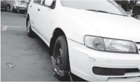  ??  ?? This file picture shows a vehicle that was clamped for failing to display parking disc