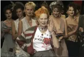  ?? MICHEL EULER — THE ASSOCIATED PRESS ?? Models applaud as British fashion designer Vivienne Westwood salutes the public after the presentati­on of her spring/summer 2006collec­tion in Paris in 2005.