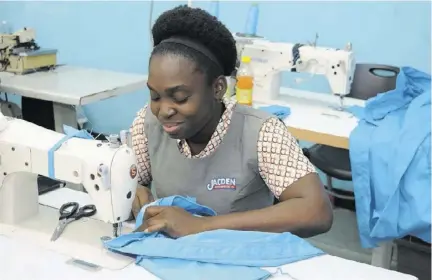  ??  ?? Jacden Enterprise­s Limited seamstress Christine Anderson hard at work