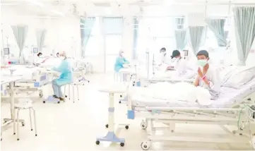  ??  ?? The rescued boys resting at a hospital in Chiang Rai,Thailand in this still image taken from a handout video. — Reuters photo