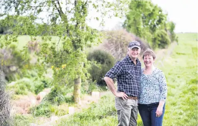  ?? PHOTO: SUPPLIED ?? Environmen­tal initiative . . . Farm owners Tony and Raewyn van Gool at a riparian planting at their Mokotua farm in Southland last year.