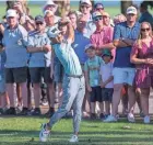  ?? ?? Fans watch Eric Cole hit an approach shot from the 10th during the final round of the Honda Classic this past February.