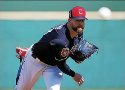  ?? ROSS D. FRANKLIN — ASSOCIATED PRESS ?? Corey Kluber warms up before a spring training game against the Oakland Athletics Feb. 27 in Goodyear, Ariz.