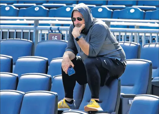  ?? GENE J. PUSKAR/AP ?? Pirates manager Derek Shelton watches a simulated game from the seats behind home plate during a workout Wednesday on the field at PNC Park in Pittsburgh.