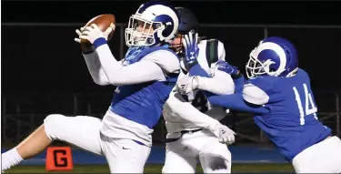  ?? JASON SCHMITT PHOTOS — FOR MEDIANEWS GROUP ?? Madison Heights Lamphere’s Jake Malak, left, intercepts a pass during his team’s playoff win over Cranbrook on Friday.