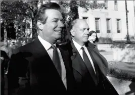  ?? ASSOCIATED PRESS ?? PAUL MANAFORT (LEFT) LEAVES FEDERAL DISTRICT COURT in Washington on Monday. Manafort, President Donald Trump’s former campaign chairman, and Manafort’s business associate Rick Gates pleaded not guilty to felony charges of conspiracy against the United...