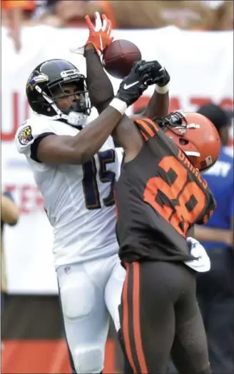  ?? DAVID RICHARD — THE ASSOCIATED PRESS ?? Browns defensive back E.J. Gaines (28) breaks up a pass intended for Ravens wide receiver Michael Crabtree on Oct. 7.