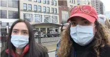  ?? MEGHAN OTTOLINI / BOSTON HERALD ?? ‘YOU NEVER REALLY KNOW’: Merary Estrada and Jinelys Torres wear surgical masks Saturday at a Bernie Sanders rally on Boston Common.