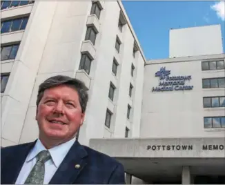  ?? KEVIN HOFFMAN — 21ST CENTURY MEDIA ?? New Pottstown Memorial Medical Center CEO J. Mark McLoone stands in front of the hospital. A Valley Forge native, McLoone said he always knew he would have an opportunit­y to “come home.”