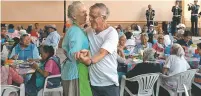  ?? LUIS ANTONIO ROJAS/WASHINGTON POST ?? Pamela Gould and Stan Allen dance at a soup kitchen organized by U.S. citizens in San Miguel de Allende, Mexico. The country’s statistics institute estimated this month that the U.S.-born population in Mexico has reached 799,000, a roughly fourfold increase since 1990.