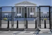  ?? JACQUELYN MARTIN / AP FILE ?? Anti-scaling fencing blocks off the Supreme Court on May 10 in Washington.