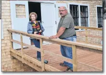  ?? ERIC MCCARTHY/JOURNAL PIONEER ?? Leard’s Mill Restoratio­n Committee member Susan Dalton and Jason Greenan, foreman for a recent project at the mill, trying out the building’s new main doors ramp.