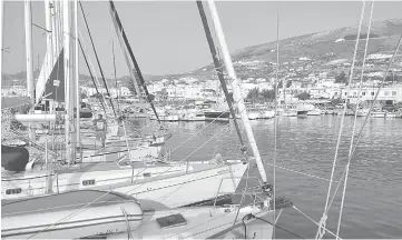  ??  ?? Attesting to its popularity, the Naoussa boat slip on the island of Paros is crowded, as the solitude of the open sea beckons.