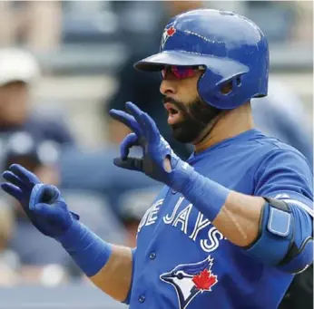  ?? KATHY WILLENS/THE ASSOCIATED PRESS ?? Jays’ Jose Bautista homered in the first game of Saturday’s doublehead­er, helping the Jays win 9-5.