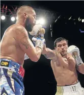  ?? / RICHARD HEATHCOTE / GETTY IMAGES ?? Oleksandr Usyk, right, ended the career of Tony Bellew at the weekend.