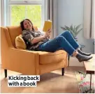  ??  ?? Kicking back with a book