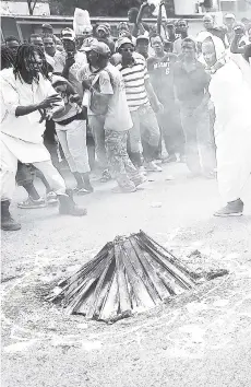  ?? FILE ?? In this June 2016 photo, Haitians take part in a voodoo ceremony in Port-au-Prince, Haiti.