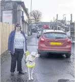  ??  ?? Safety Margaret Murphy hit out after the work to erect barriers in Station Road has been stopped after complaints