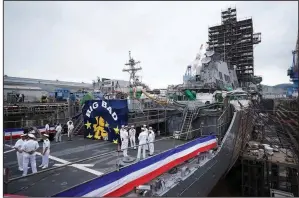  ?? AP/EUGENE HOSHIKO ?? The USS John S. McCain, officially named Thursday for U.S. Sen. John McCain, sits in dry dock as it undergoes repairs at the U.S. naval base in Yokosuka, Japan.