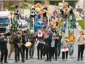  ?? OHAD ZWIGENBERG/AP ?? Performers play music during the Purim parade Monday in Jerusalem, its first in 42 years.