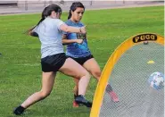  ??  ?? Fusion teammates Hannah Duffy, left, and Monique Nevarez battle for possession in practice. Their team advanced to State Cup finals.