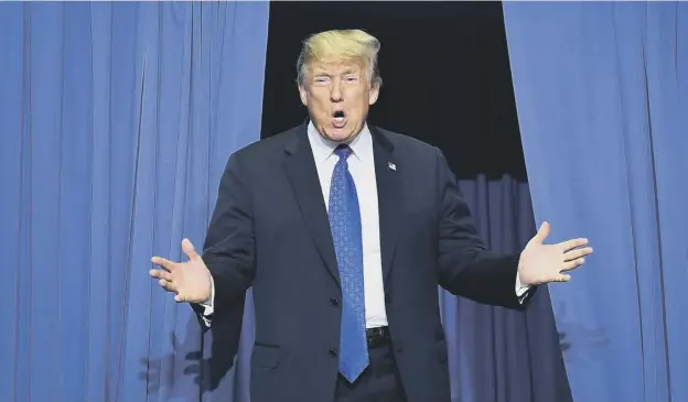  ?? PICTURE: GETTY IMAGES ?? 0 Donald Trump speaks at a rally in Southaven, Mississipp­i, in a bid to sway the outcome of an election that could tip the balance of the Senate