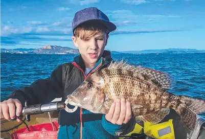  ??  ?? Nate Tyack, 9, of Gulliver caught this fine grass emperor in shallow Townsville waters.