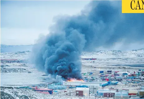  ?? FRANK REARDON / THE CANADIAN PRESS ?? A fire burns at a Northmart store in Iqaluit, Nunavut, on Wednesday. “It’s the hub of the community,” said one resident.