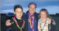  ??  ?? ABOVE: Josh Quigley Power and Haley Power with chief scout Christy McCann; RIGHT: scouts on the march.