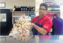  ?? MICHAEL MAYO/STAFF ?? Jose Sanchez, a manager at Delaware Chicken and Seafood Market in Hollywood, says the shortage has cut weekly sales from 1,500 pounds to 500.