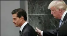 ?? AP PHOTO/DARIO LOPEZ-MILLS ?? Then-Republican presidenti­al nominee Donald Trump walks with Mexican President Enrique Pena Nieto at the end of their joint statement at Los Pinos, the presidenti­al official residence, in Mexico City.
