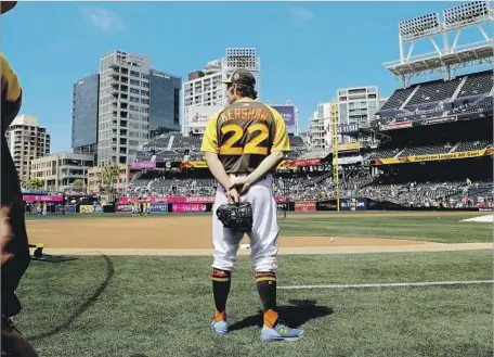  ?? Jae Hong Associated Press ?? DODGERS ACE Clayton Kershaw, who is on the disabled list because of a back injury, wears the uniform of the National League All-Stars while watching batting practice before the home run derby at San Diego’s Petco Park.