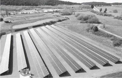  ?? BLUE LAKE RANCHERIA 2017 ?? An aerial photo shows a solar array that is paired with a microgrid in Blue Lake, California. A Native American reservatio­n on California’s far northern coast kept the power flowing in Humboldt County with the help of microgrids during 2019 blackouts.