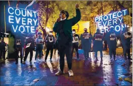  ?? ERIKA SCHULTZ — THE SEATTLE TIMES ?? On Nov. 4, Travonna Thompson-Wiley, with the Black Action Coalition, speaks at the “Count Every Vote - Protect Every Person,” rally and march in Occidental Park in Seattle. The coalition demanded that every vote is counted and orderly transition of power, as well as the eliminatio­n the Electoral College.