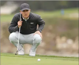  ??  ?? Jordan Spieth lines up a putt on the sixth green in California