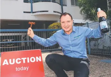  ?? Picture: JUSTIN BRIERTY ?? ON A WINNER: DJ Smith Property auctioneer Darcy Smith sold this Minnie St apartment to a first-home buyer and says auctions are a more successful way of selling.