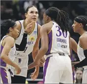  ?? Steph Chambers Getty Images ?? LIZ CAMBAGE, second from left, said one of the reasons she signed with the Sparks was because of Williams after a “pinkie promise” in 2018.