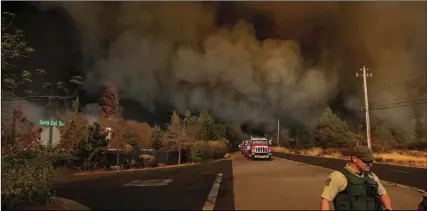  ?? AP PHOTO/NOAH BERGER ?? The Camp Fire rages through Paradise, on Thursday.