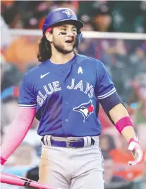  ?? CARMEN MANDATO/GETTY IMAGES ?? Bo Bichette reacts to a called strike during the seventh inning of Sunday's 7-4 loss to the Astros. Bichette has been a bright spot for the Jays in the early going, writes Rob Longley.