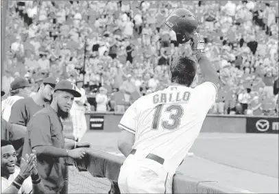  ?? PHOTOS by TIM HEITMAN/ USA TODAY ?? Joey Gallo tips his cap to the fans after his home run in the third inning, after some prodding from veteran Rangers slugger Prince Fielder. “I’ve never done that before,” Gallo said. “I just wanted to make sure it was for me. I didn’t know what was...