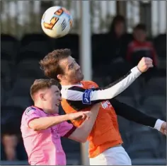  ??  ?? Conor Sutton tussles in the air with Athlone’s Walter Invernizzi.