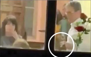  ?? ?? CAUGHT: Sir Keir Starmer holding a bottle of beer, circled, at the Labour constituen­cy office in Durham