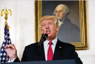  ?? CHRIS KLEPONIS / GETTY IMAGES ?? Pressured by Republican­s and Democrats to speak out, President Donald Trump on Monday declared “racism is evil” and condemned white supremacis­t groups by name.