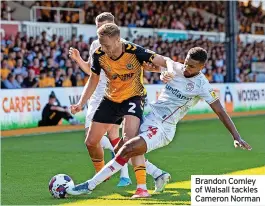  ?? ?? Brandon Comley of Walsall tackles Cameron Norman