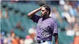  ??  ?? Rockies pitcher German Marquez reacts after giving up a three-run home run on Monday in Denver. DAVID ZALUBOWSKI/AP