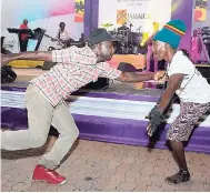  ??  ?? Two engaging dancers at Wednesday’s Internatio­nal Women’s Day concert at Emancipati­on Park, New Kingston.