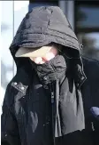  ?? TROY FLEECE ?? Former teacher Martina Cain covers her face as she leaves a disciplina­ry hearing.