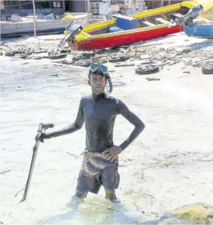  ??  ?? Omar Mcpherson, a spearfishe­rman at the Hellshire beach in St Catherine