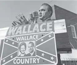  ?? ASSOCIATED PRESS FILE PHOTO ?? Alabama Gov. George C. Wallace gestures in 1966 as he makes an election campaign speech for his wife, Lurleen, in Wetumpka, Ala.