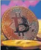  ?? REUTERS ?? Bitcoin hit a record $50,350.06 before paring some of the gains to trade at $49,425.17.
